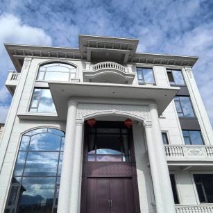 云南白麻别墅外墙干挂石材效果示例